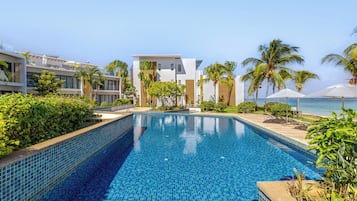 Outdoor pool, pool umbrellas, sun loungers