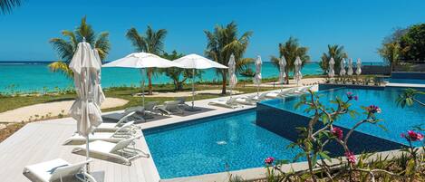 Outdoor pool, pool umbrellas, sun loungers