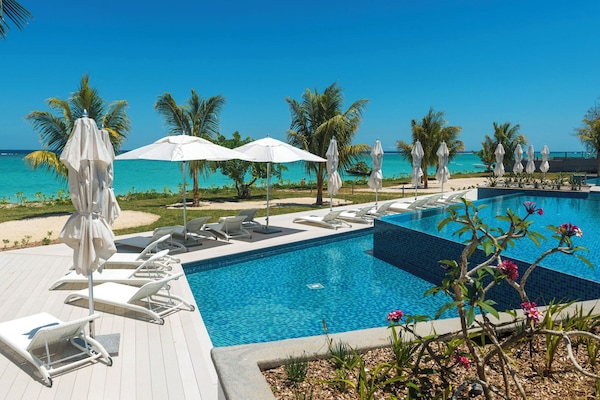 Outdoor pool, pool umbrellas, sun loungers