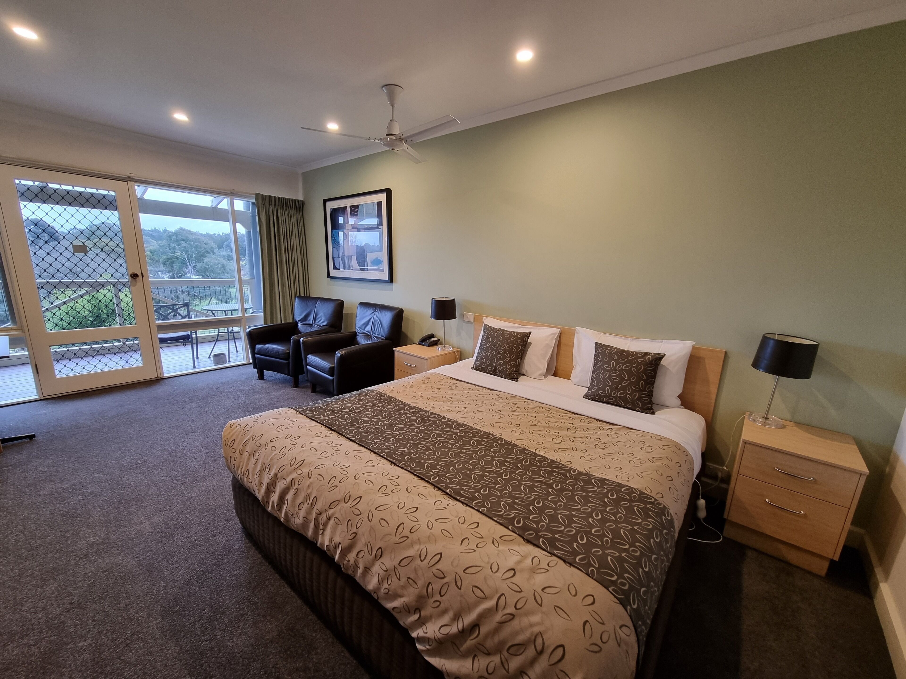 Premium bedding, laptop workspace, blackout drapes, iron/ironing board