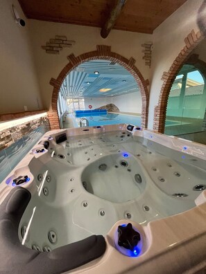 Indoor pool, seasonal outdoor pool, pool umbrellas, pool loungers