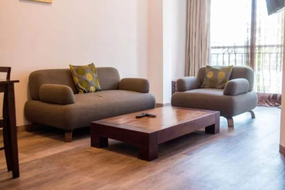 A living room with two sofas and a coffee table.