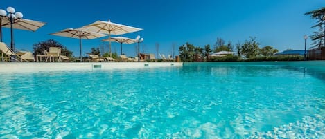 Seasonal outdoor pool, pool umbrellas, sun loungers