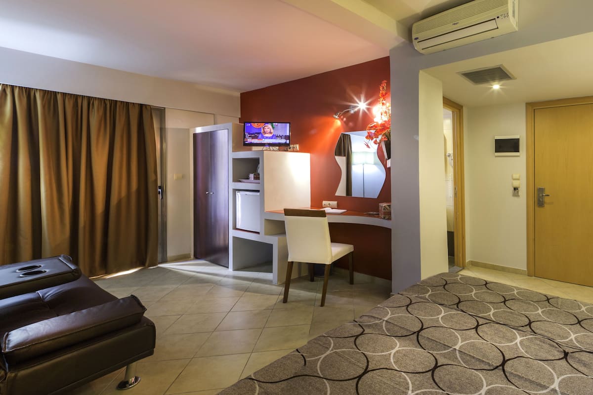 Triple Room, City View | Living area | 19-inch plasma TV with satellite channels, TV