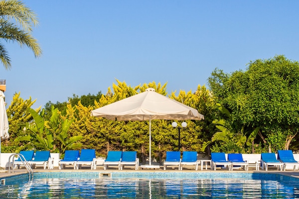 Seasonal outdoor pool, pool umbrellas, sun loungers