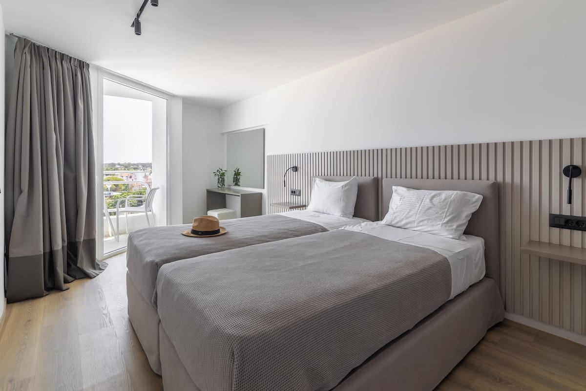 Double Room, Partial Sea View | Premium bedding, minibar, in-room safe, desk