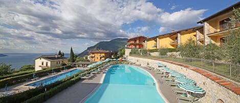 Seasonal outdoor pool, pool umbrellas, pool loungers