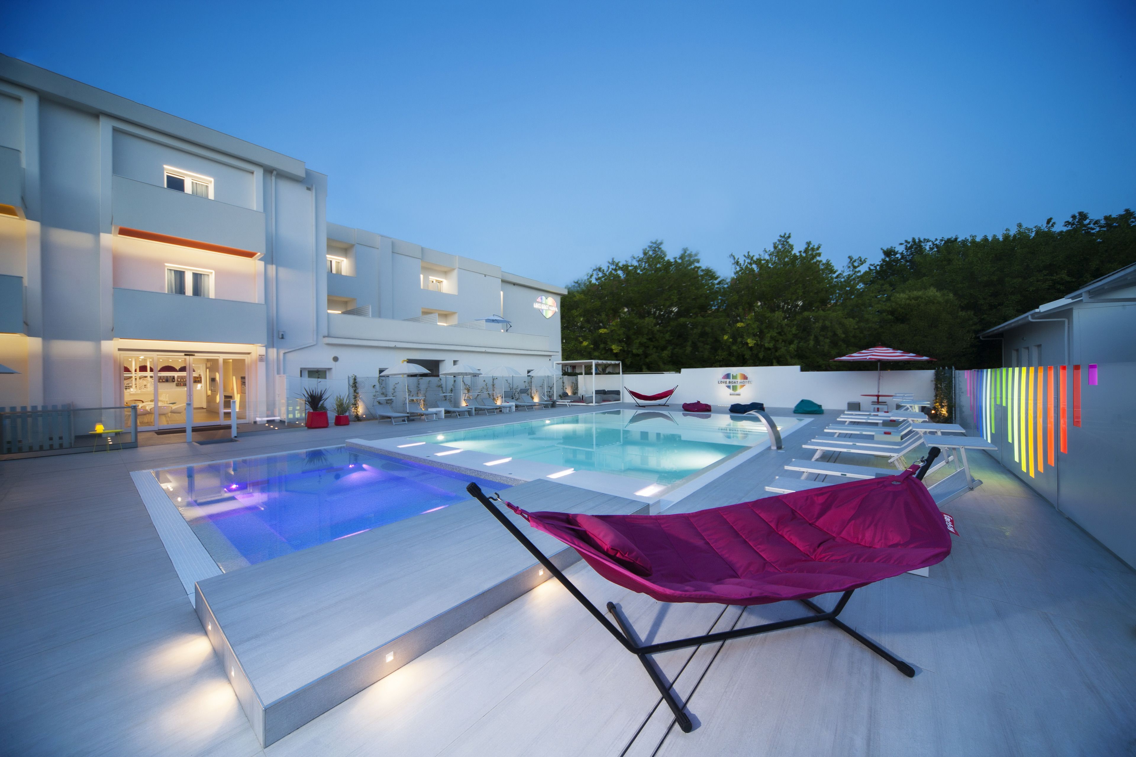 seasonal outdoor pool, open 9 am to 8 pm, pool umbrellas, pool loungers