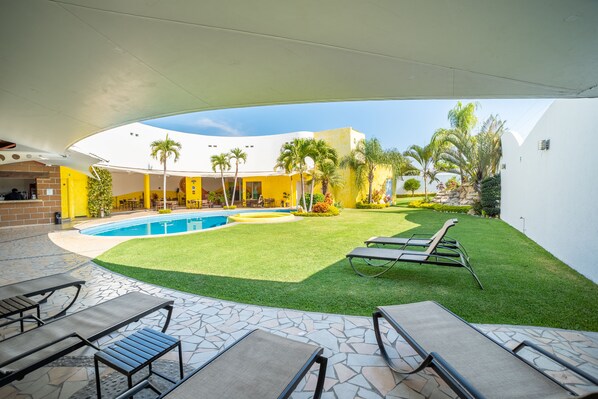 Outdoor pool, open 8 AM to 10 PM, pool umbrellas, sun loungers