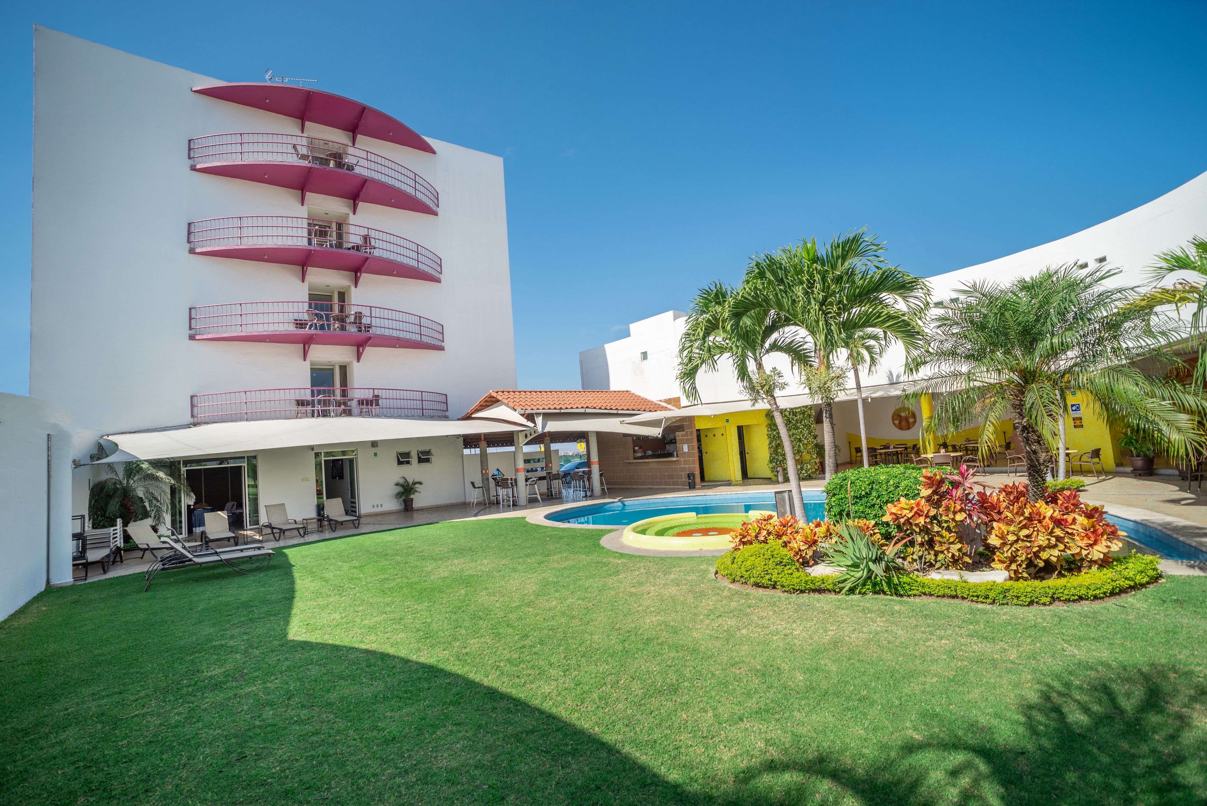 outdoor pool, open 8 am to 10 pm, pool umbrellas, pool loungers