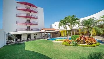 Outdoor pool, open 8 AM to 10 PM, pool umbrellas, sun loungers