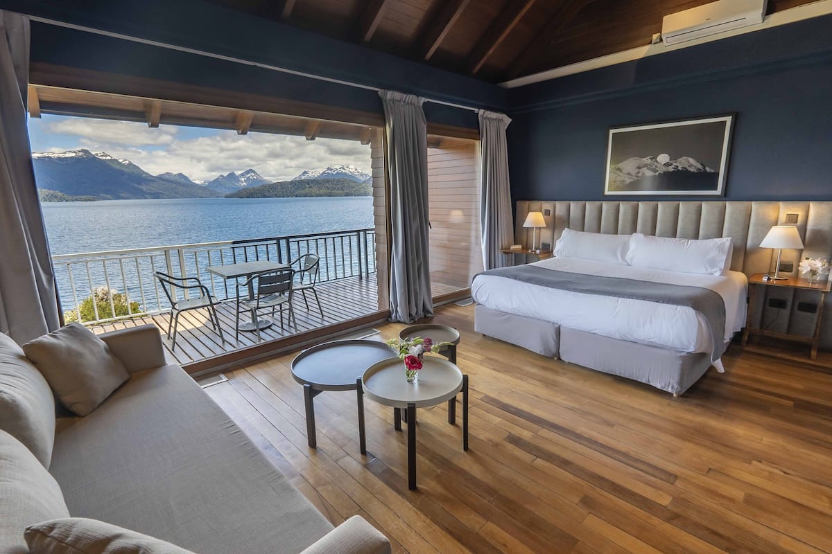 deluxe double room, lake view | down duvets, pillow-top beds, minibar, in-room safe