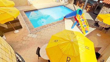 Outdoor pool, open 9:00 AM to 9:00 PM, pool umbrellas, sun loungers