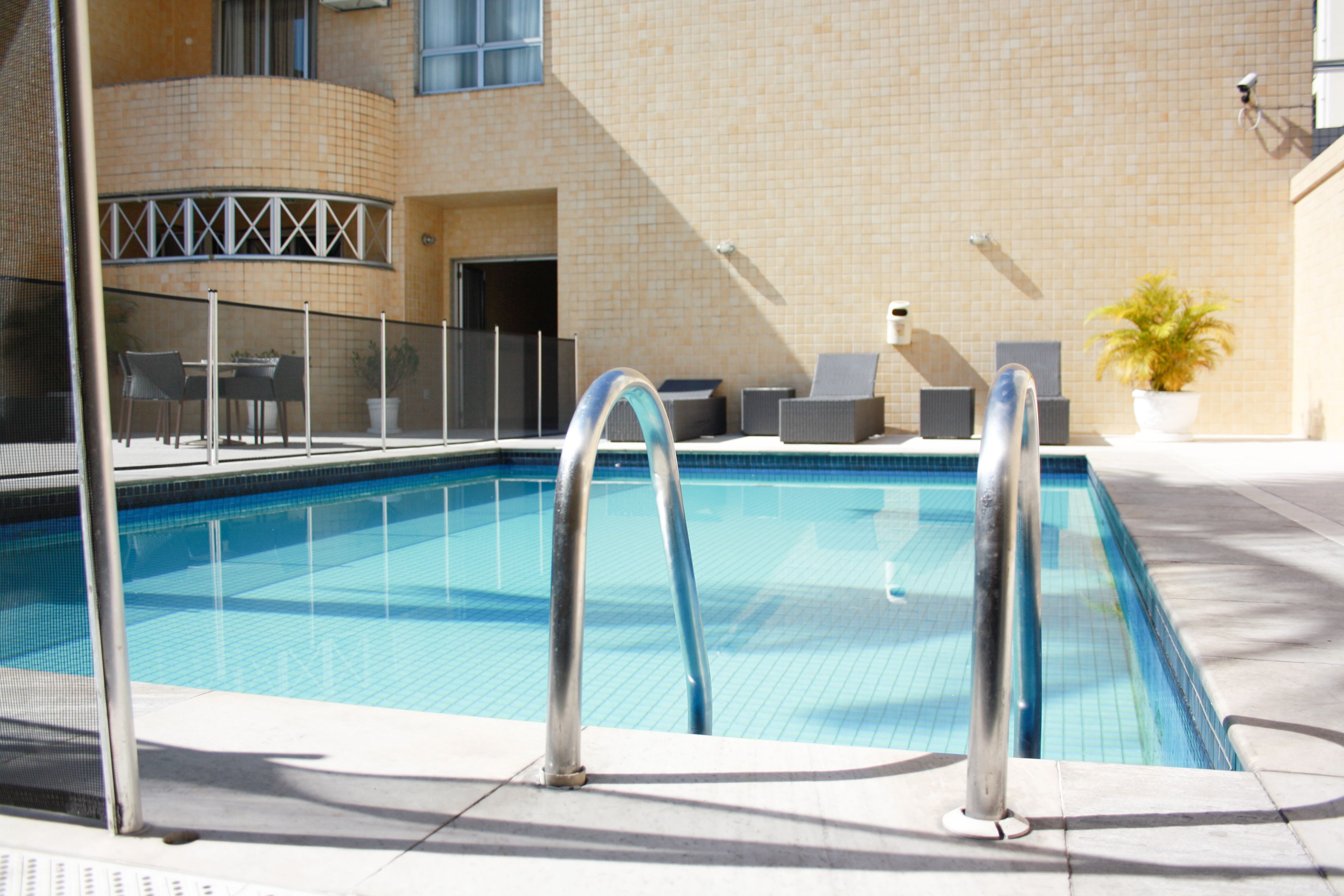 outdoor pool, pool umbrellas, pool loungers