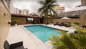 Outdoor pool, open 9:00 AM to 9:00 PM, pool umbrellas, pool loungers