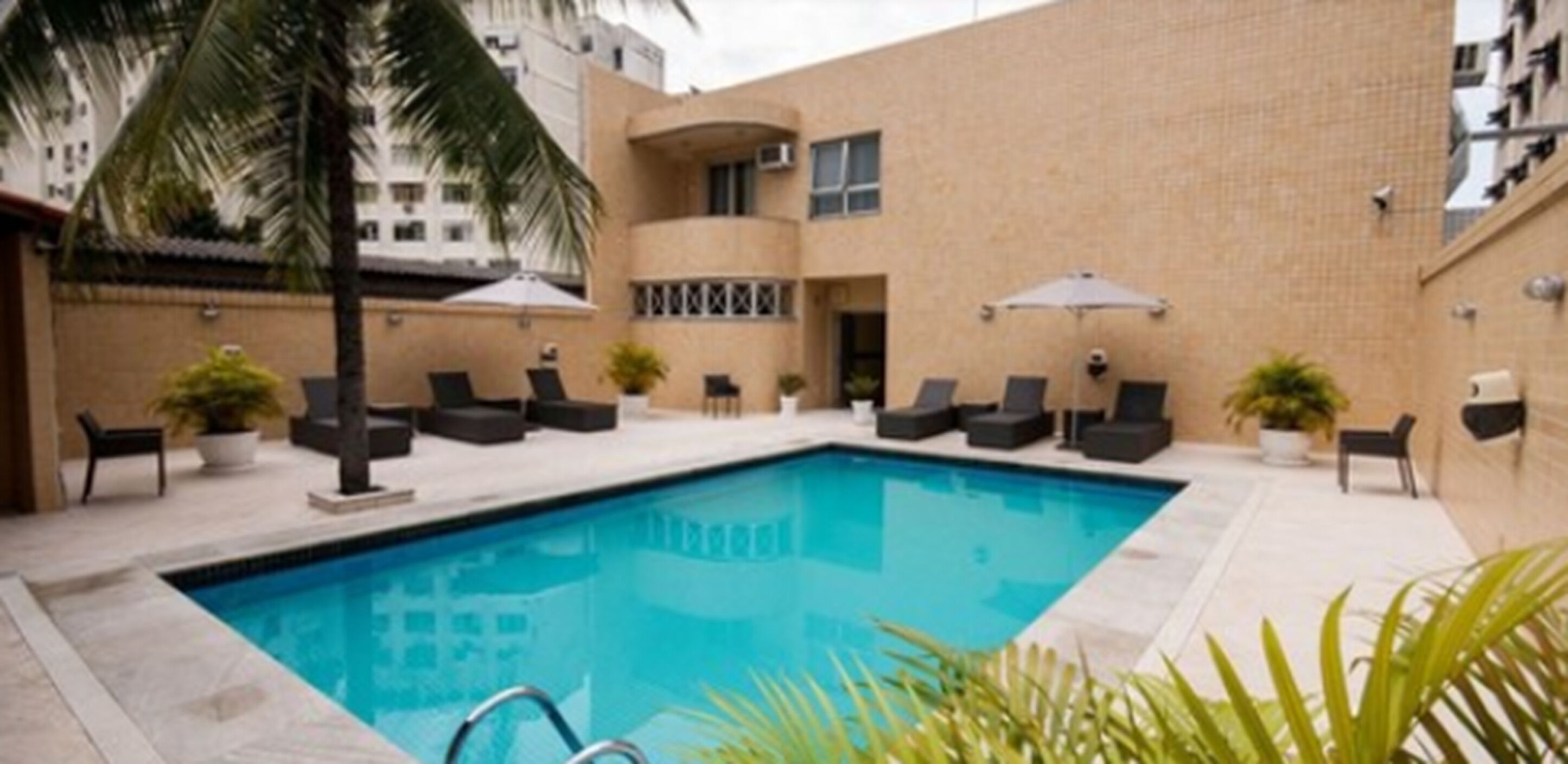 outdoor pool, pool umbrellas, pool loungers