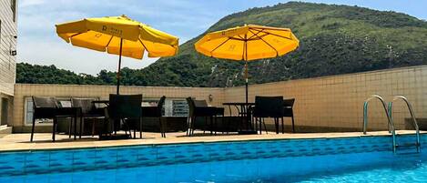 Outdoor pool, open 9:00 AM to 10:00 PM, pool umbrellas, sun loungers