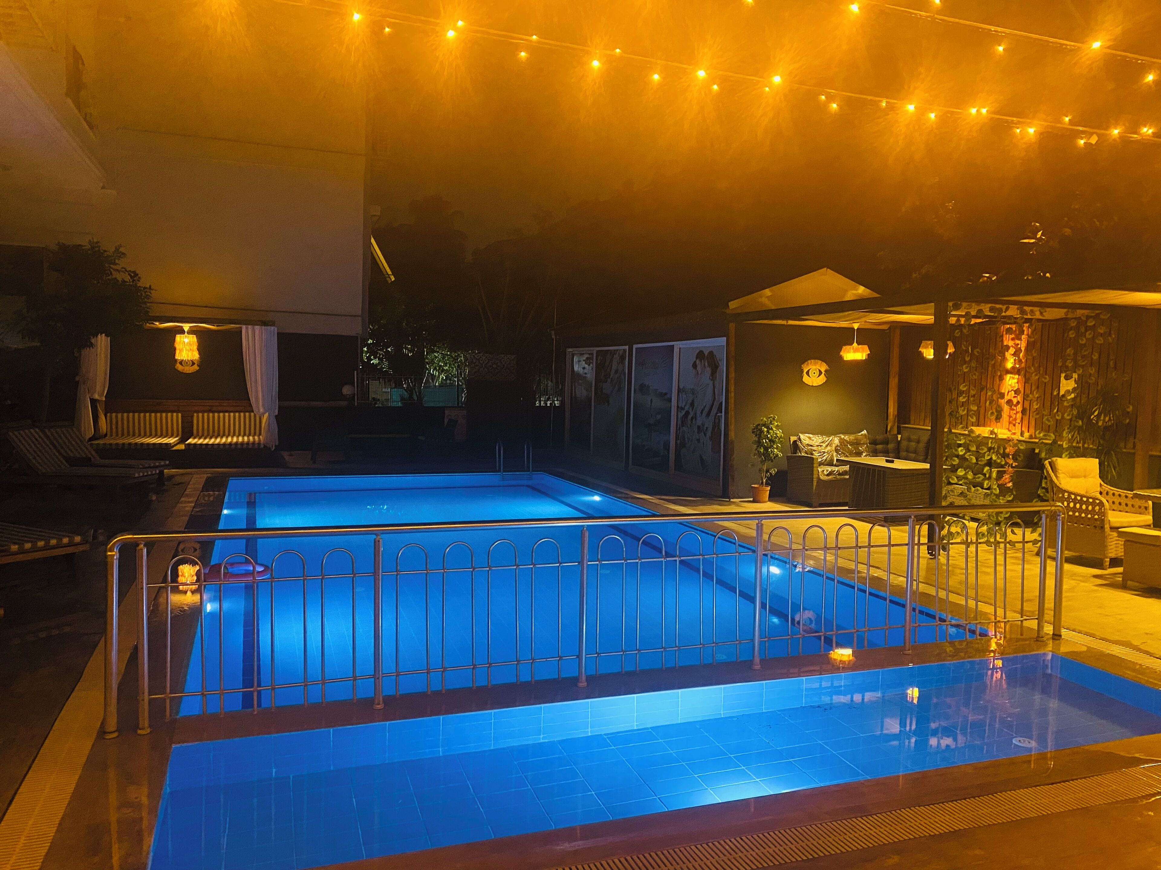 Seasonal outdoor pool, open 9:00 AM to 7:00 PM, pool umbrellas