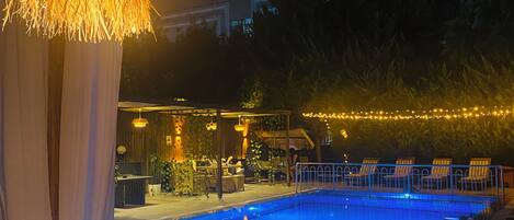 Seasonal outdoor pool, open 9:00 AM to 7:00 PM, pool umbrellas