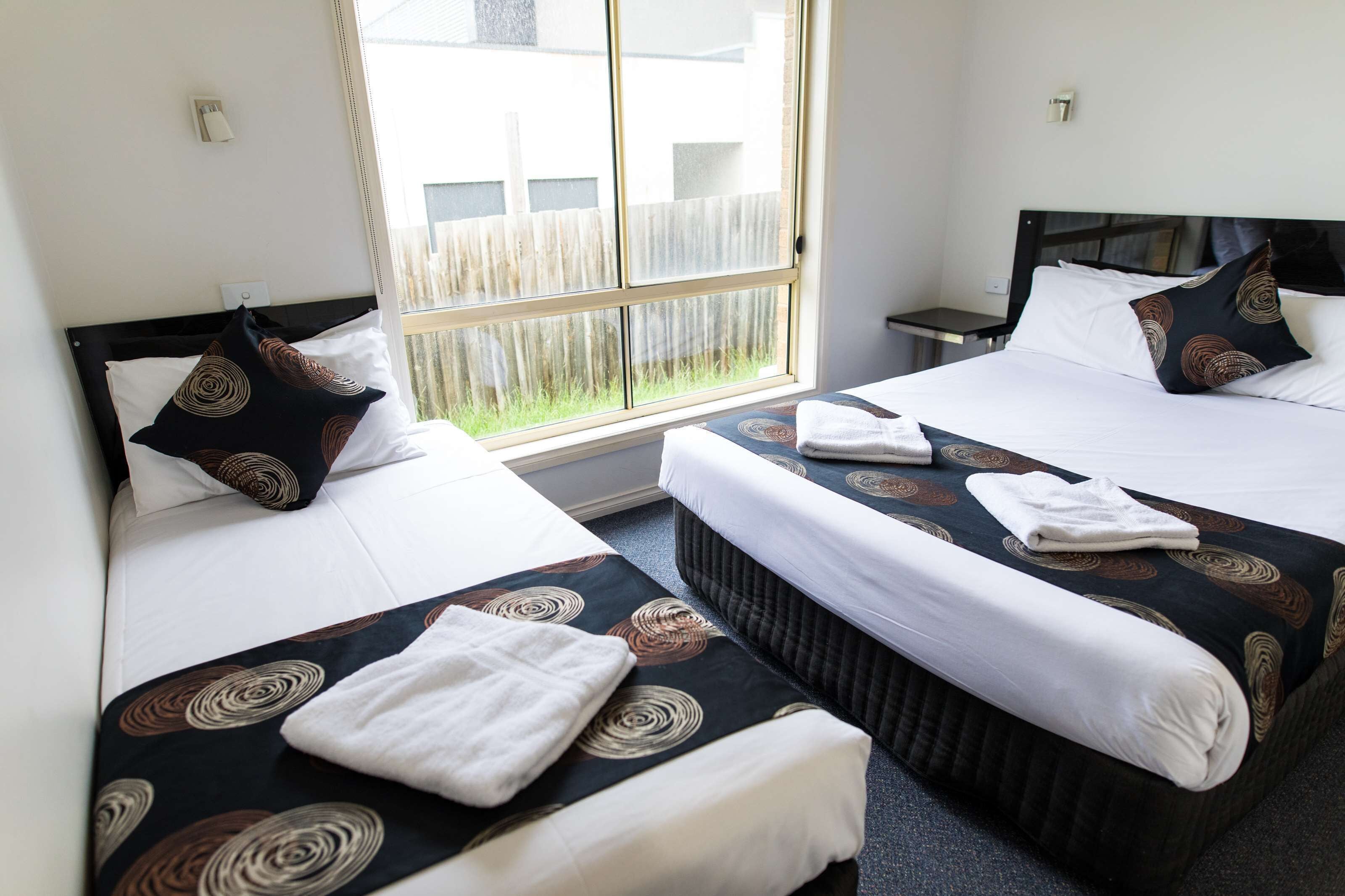 deluxe suite, multiple beds, non smoking, kitchenette (walk-in shower) | desk, laptop workspace, blackout curtains, soundproofing