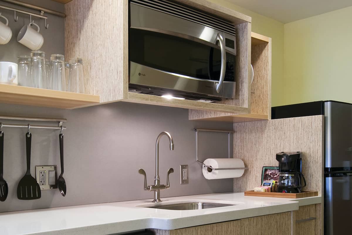 studio, 2 queen beds | private kitchenette | full-sized fridge, microwave, stovetop, dishwasher