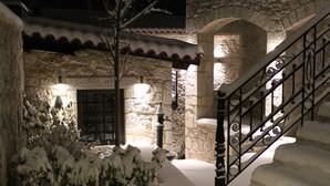 A stone staircase with a wrought iron railing leading to an upper level. - Villa Vager (Tripoli)