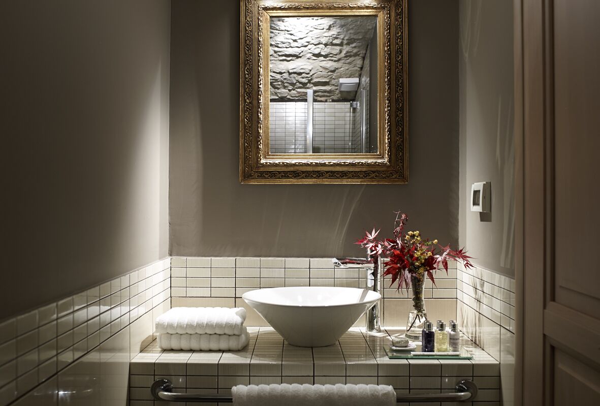 suite | bathroom | shower, designer toiletries, hair dryer, slippers