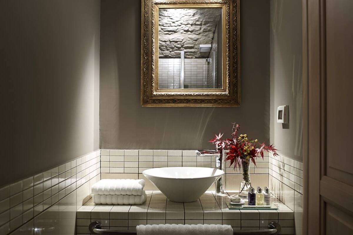 suite | bathroom | shower, designer toiletries, hair dryer, slippers