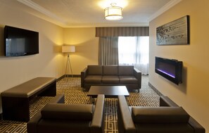 Luxury Suite, 1 King Bed, Jetted Tub | Living room | 50-inch Smart TV with cable channels, TV - Visitors Inn (Hamilton)