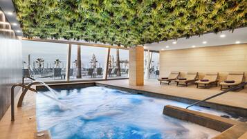 Indoor pool, outdoor pool, pool umbrellas, sun loungers