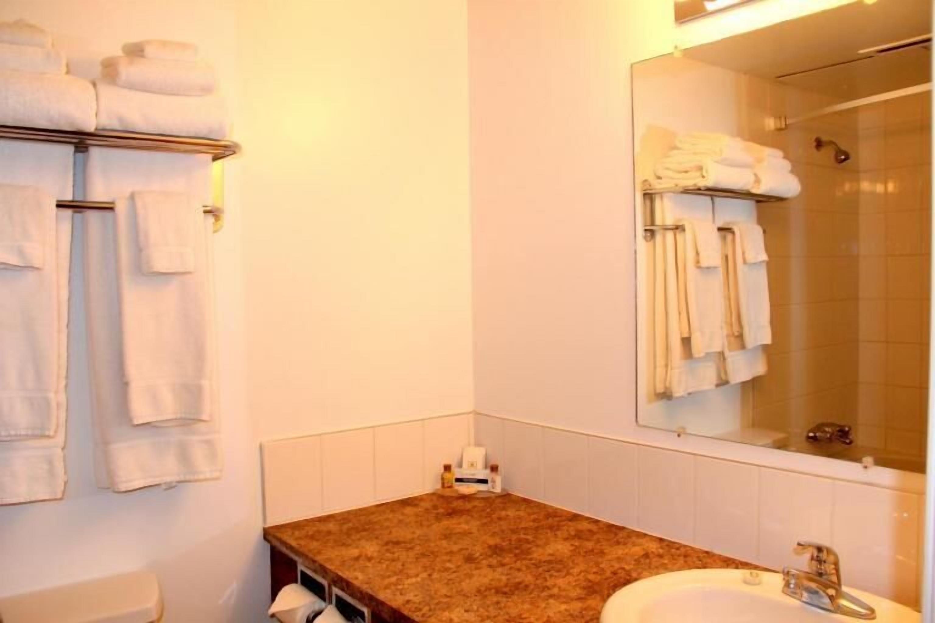 room, 1 queen bed, kitchenette | bathroom sink