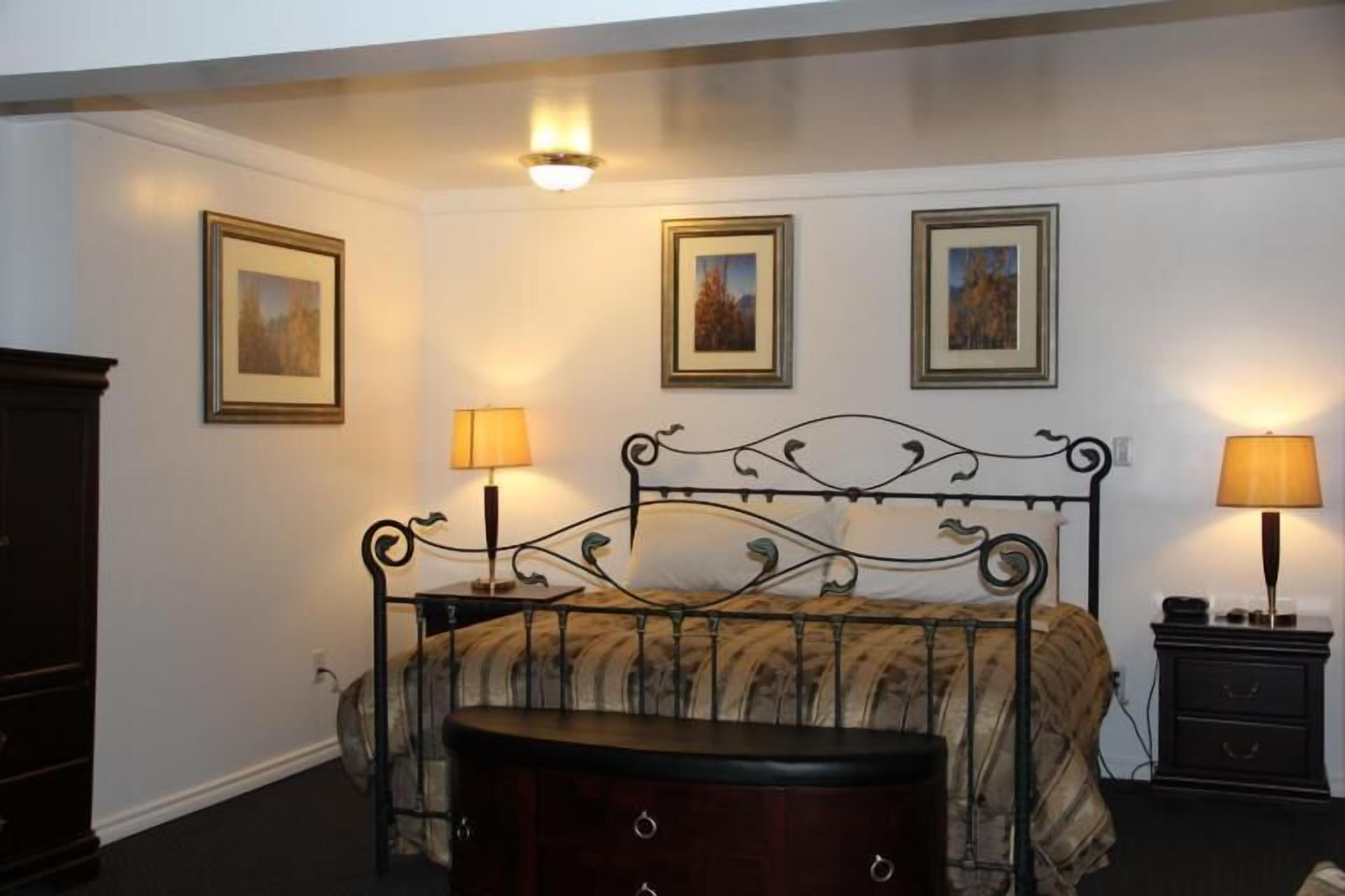 suite, 1 king bed, kitchenette | desk, iron/ironing board, rollaway beds, free wifi