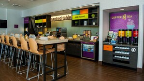 A modern cafe with a self-service coffee station, a 'Good Morning' sign, and a 'Coffee 2 Tea' sign. - Home2 Suites by Hilton Salt Lake City-Murray, UT (Murray)