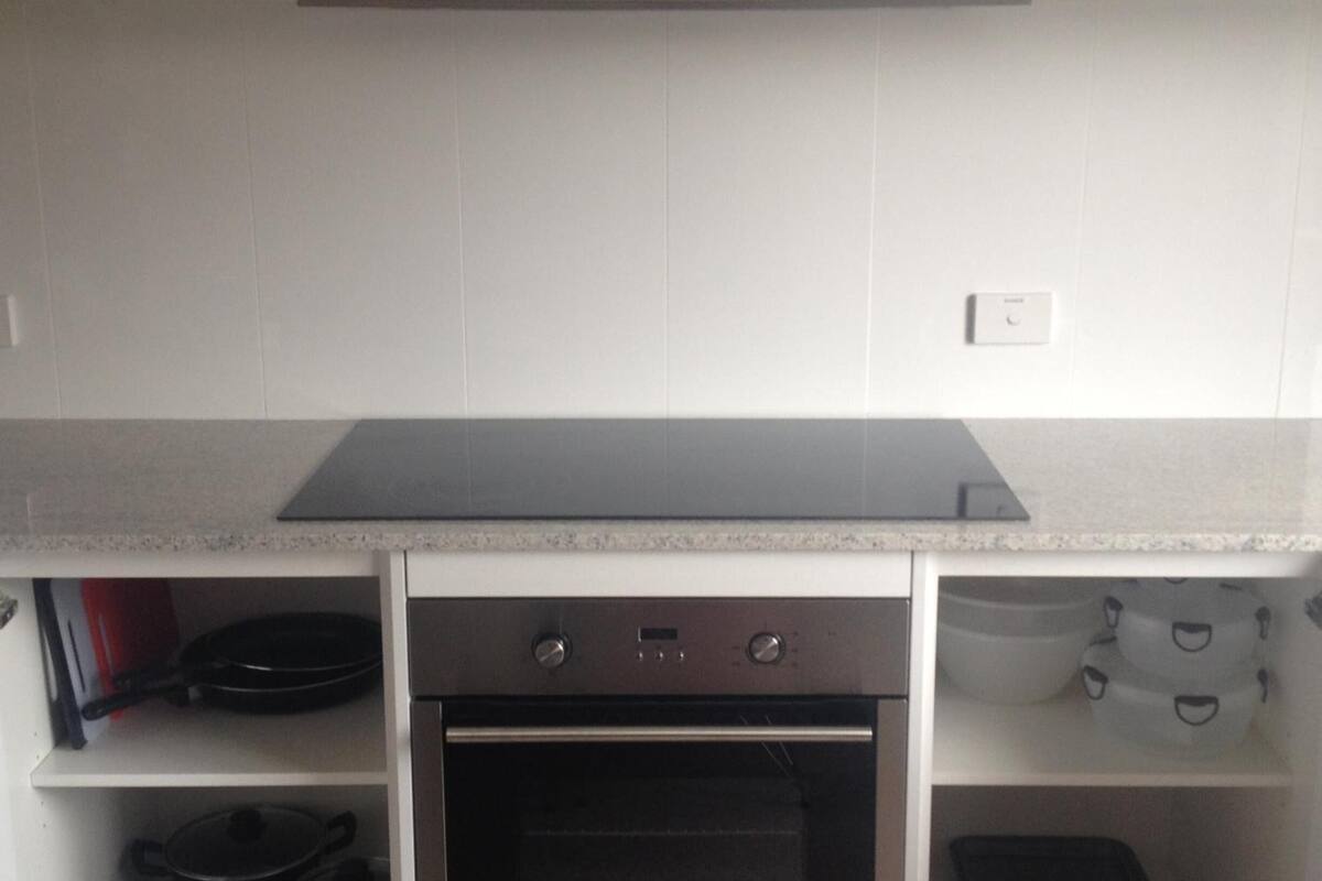 mini-fridge, microwave, electric kettle, cookware/dishes/utensils
