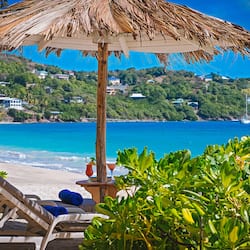 On the beach, white sand, sun loungers, beach umbrellas