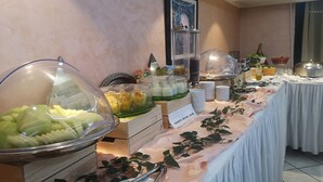 A buffet setup with various food items and a sign indicating 'Yogurt's Nature Sucre'. - Majliss Hotel (Rabat)