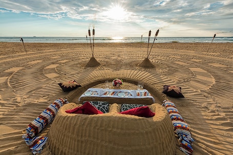 On the beach, beach towels, water skiing, windsurfing