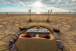 On the beach, beach towels, water skiing, windsurfing