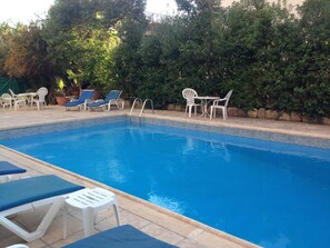 Outdoor pool, pool umbrellas, pool loungers