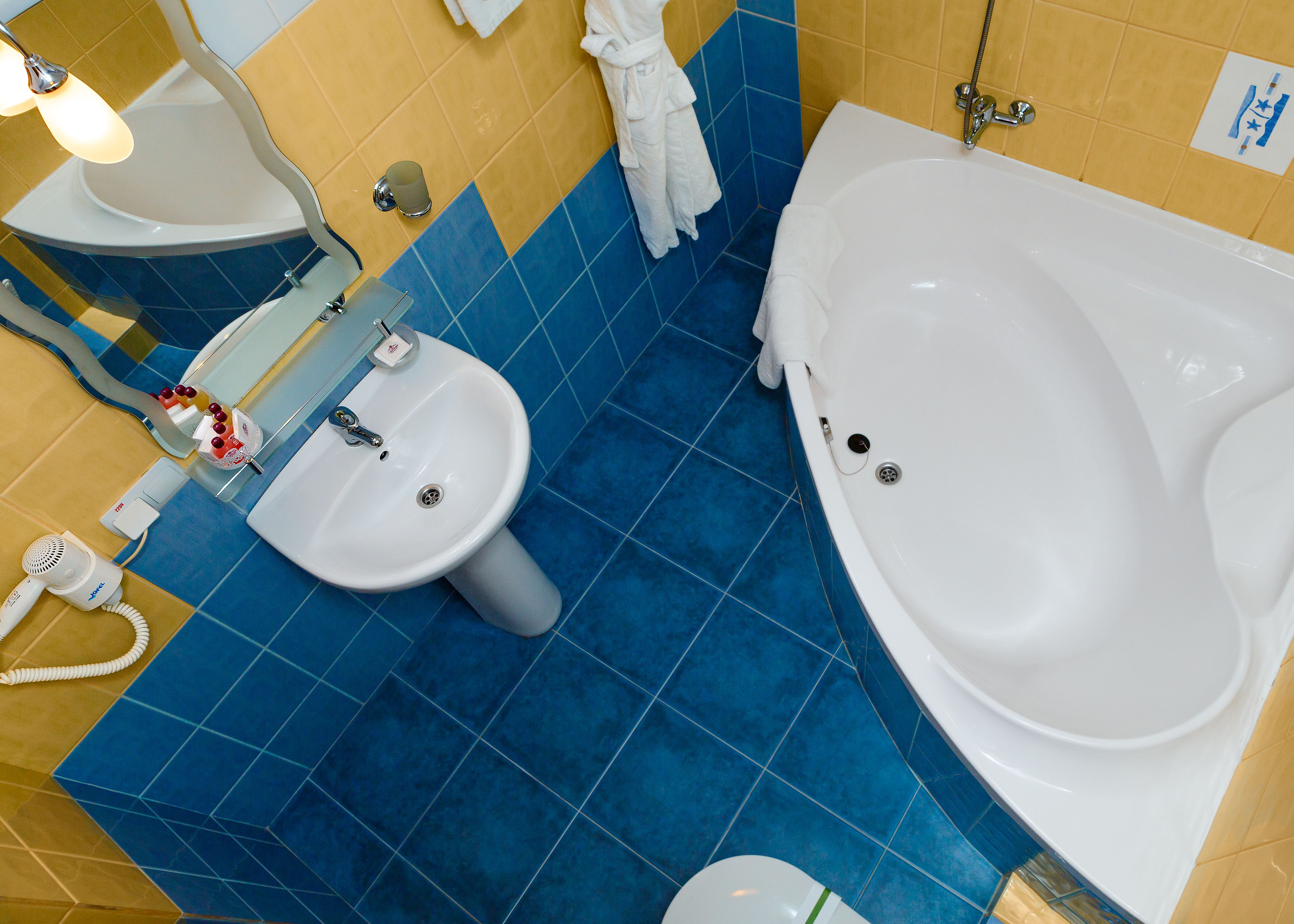 A bathroom with a sink, a bathtub, and a toilet.