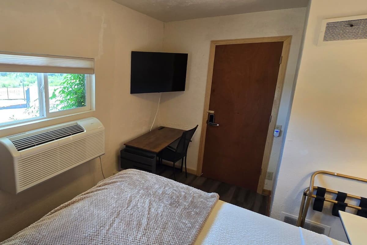 Economy Single Room, Mountain View | Down comforters, blackout drapes, iron/ironing board, WiFi (free)