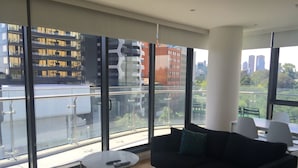 Two Bedroom One Bathroom Apartment | Living area | 32-inch LCD TV with cable channels, TV, DVD player - Apartments Melbourne Domain – St Kilda Road (South Melbourne)