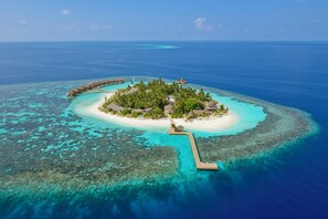 An aerial view of a tropical island resort with overwater bungalows, a central island with a gazebo, and a clear blue sea. - Kandolhu Maldives (NORTH ARI ATOLL)