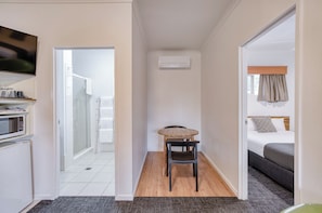 Deluxe Suite, Non Smoking, Pool View | Premium bedding, desk, laptop workspace, blackout drapes