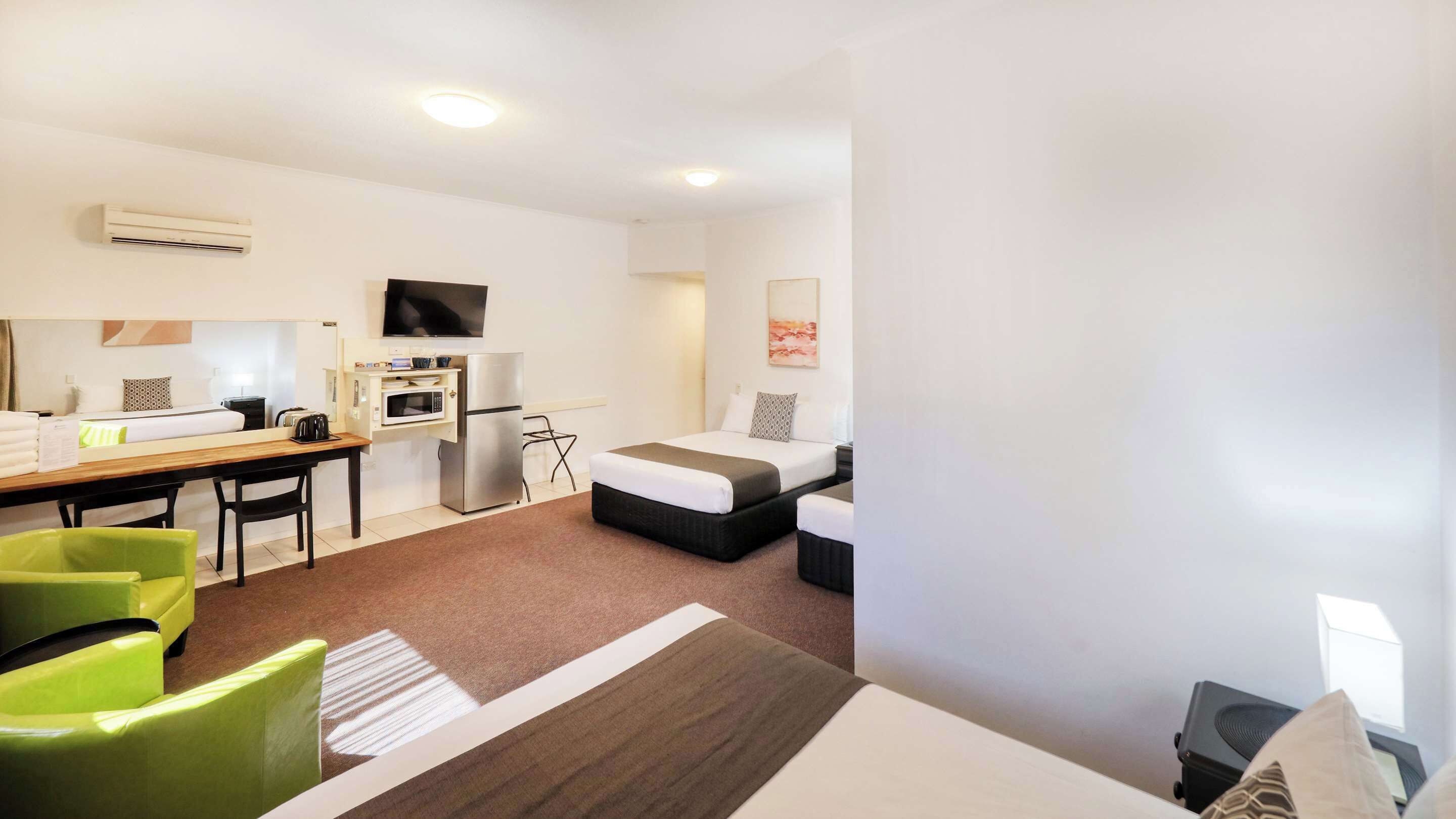 deluxe room, multiple beds, non smoking, refrigerator & microwave (2 queen and 1 single bed) | 1 bedroom, premium bedding, individually decorated