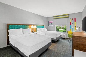 A hotel room with two beds, a desk, a chair, a window with a view, and a wall with a painting. - Hampton Inn Omaha/West Dodge Road (Old Mill) (Omaha)