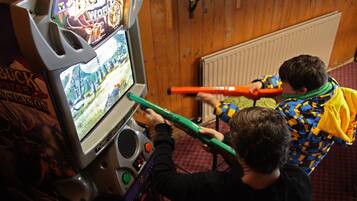 Enjoy a round of Big Buck's at our gaming arcade, where you can test your skills and win prizes.