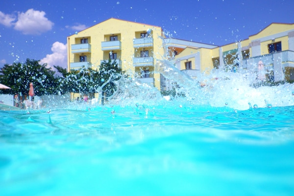 Outdoor pool, pool umbrellas, pool loungers