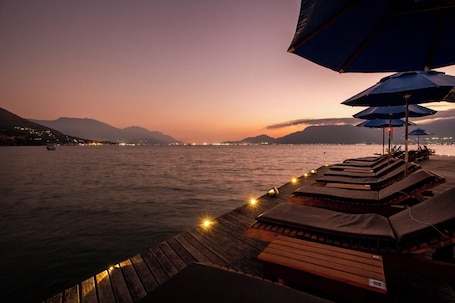 On the beach, sun loungers, beach umbrellas, beach towels