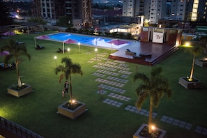 Outdoor pool, a heated pool, pool umbrellas, pool loungers